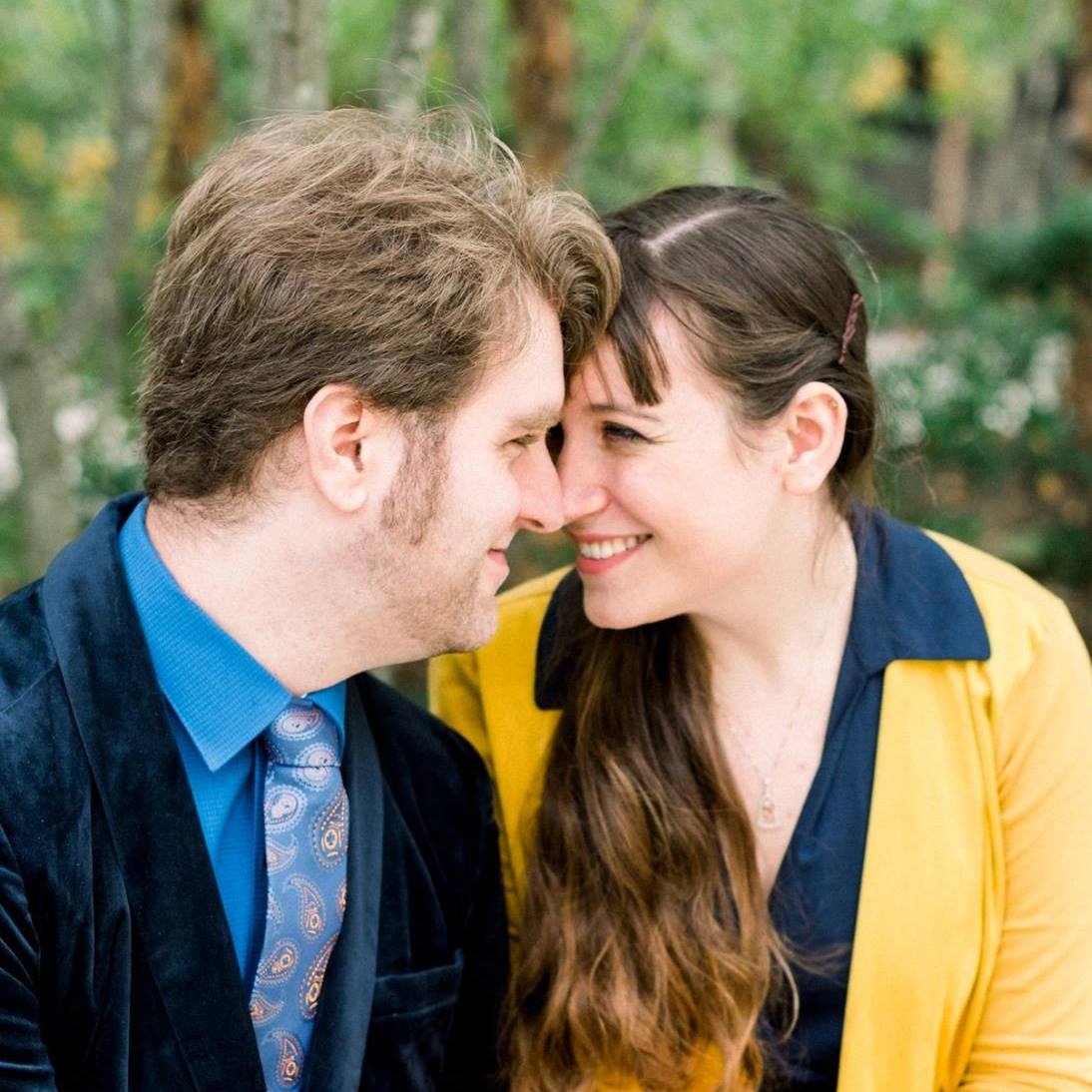 Anna and Dan sitting and looking into each other's eyes